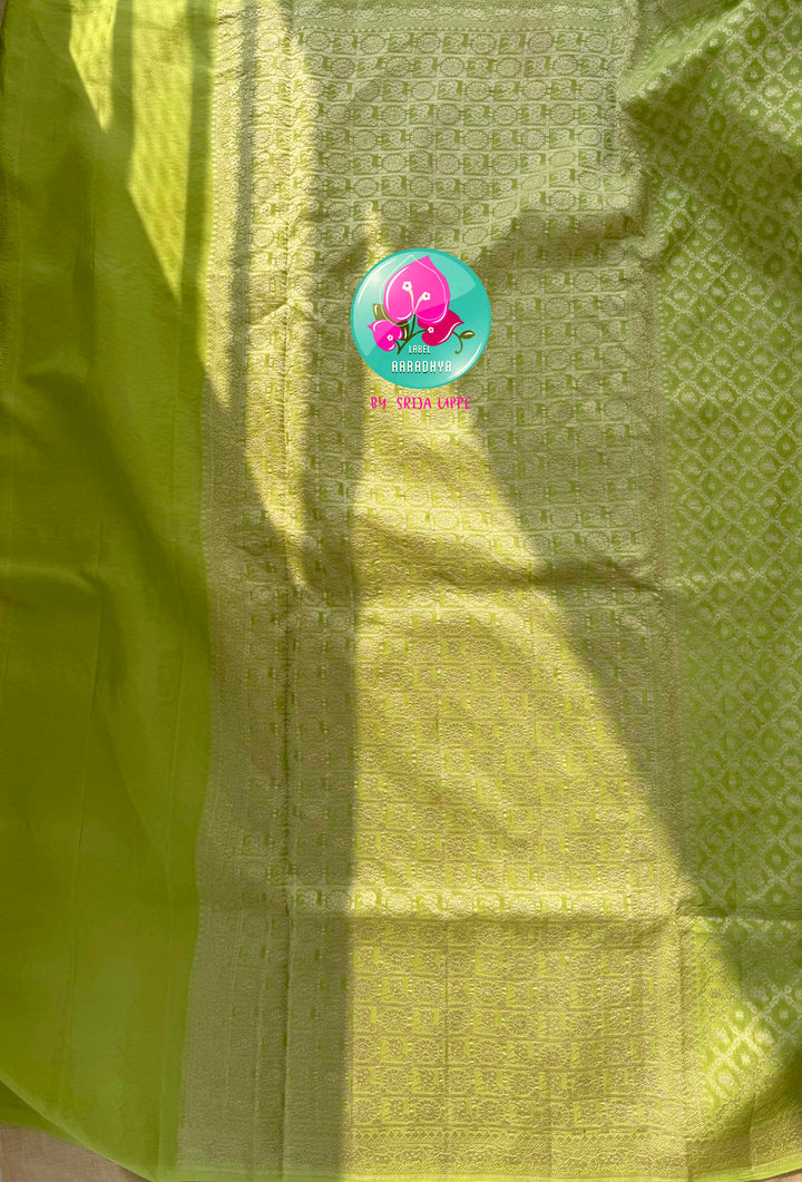 Verdant Radiance: Parrot Green Banarasi Khaddi Georgette Saree with Nandhini Grace with hand embroidered blouse