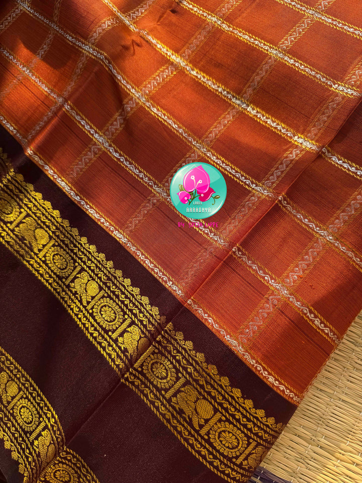 Sovereign Earth: Rust Orange & Dark Brown Kanchipattu Saree with Gandaberunda Artistry