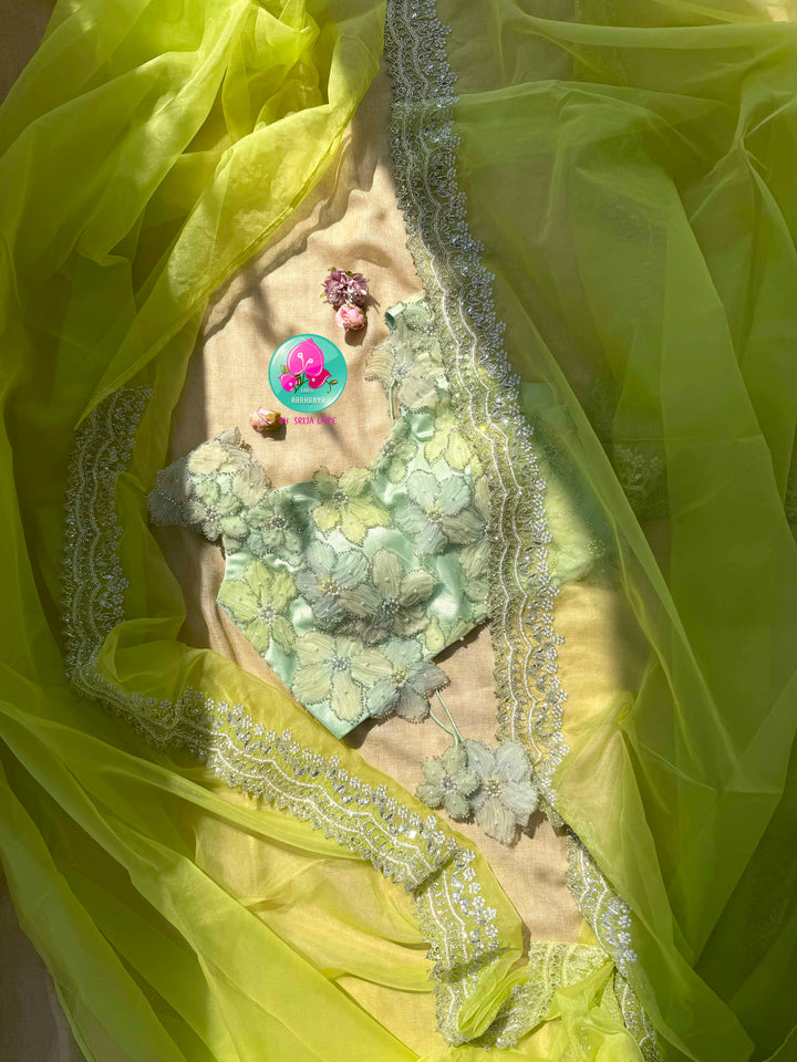 Neon Green Organza Saree with Silver Kardana & green palette embroidered Net