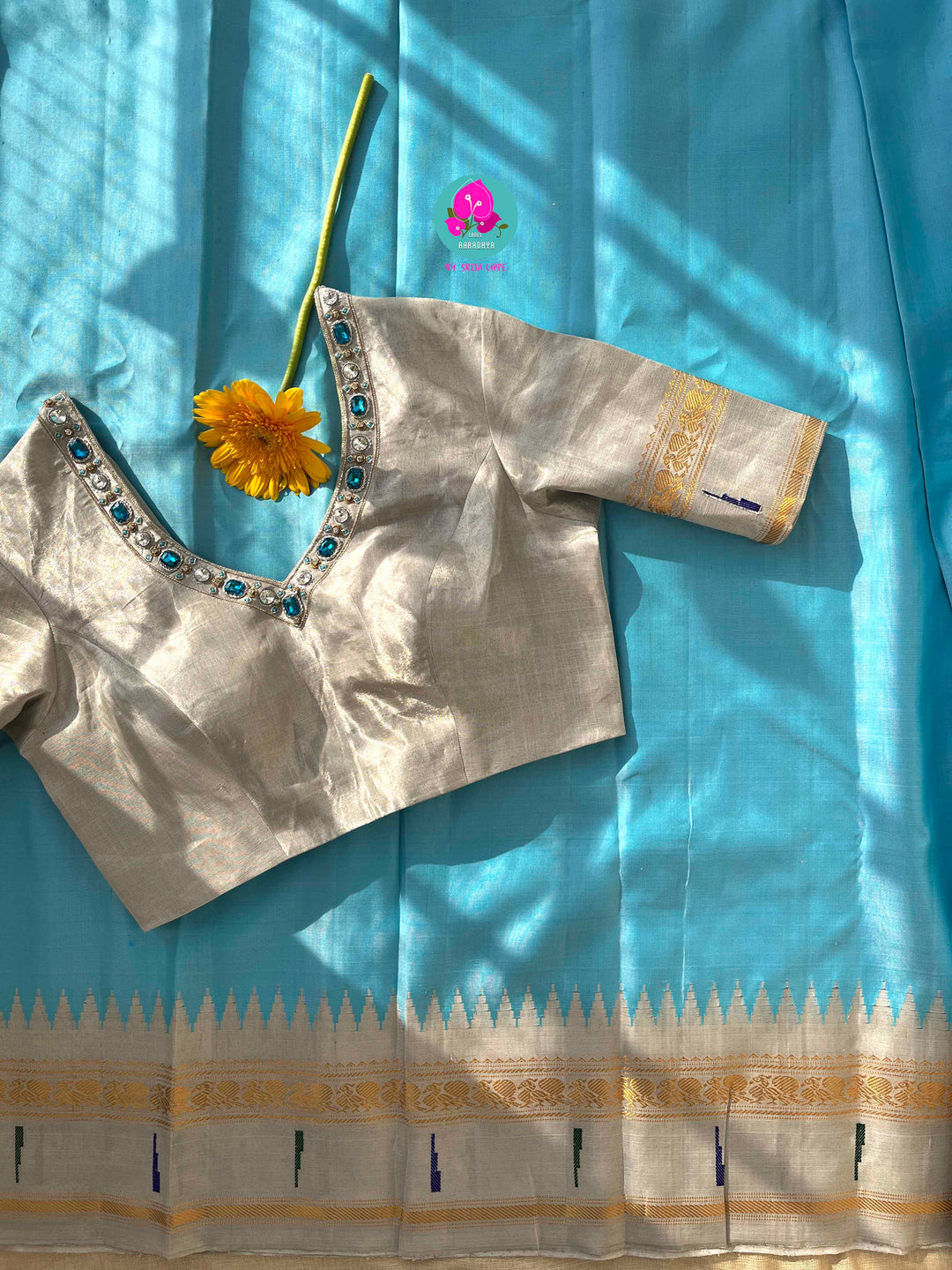 Light Blue Tissue Gadwal muniya border saree with Hand-Embellished Party Wear Detail