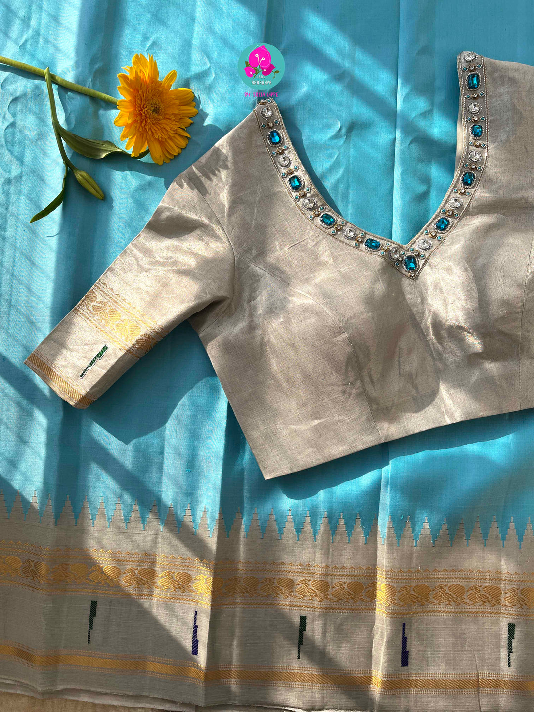 Light Blue Tissue Gadwal muniya border saree with Hand-Embellished Party Wear Detail