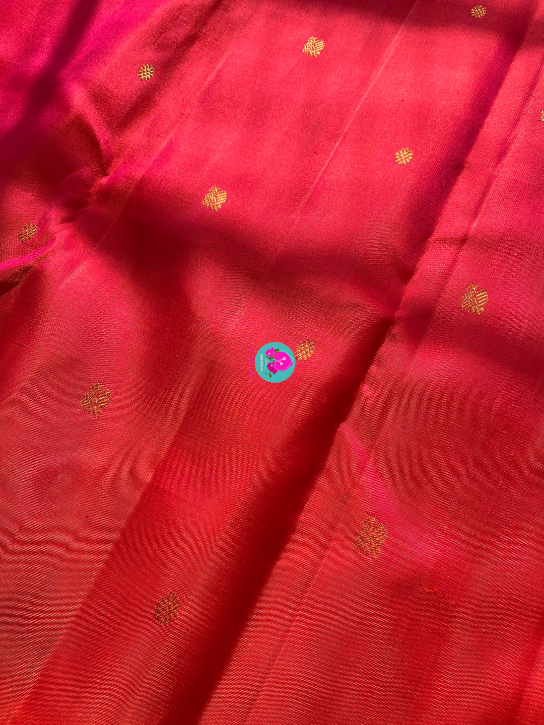 Pinkish shade of red with deep purple border Kanchipuram silk Saree paired with hand embroidered blouse