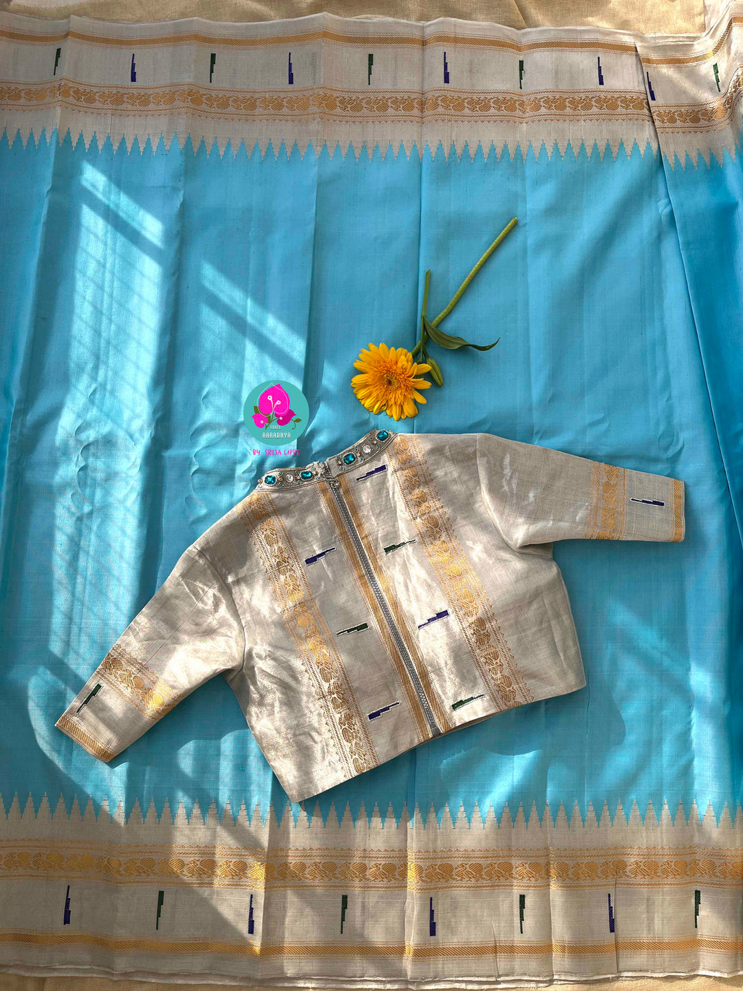 Light Blue Tissue Gadwal muniya border saree with Hand-Embellished Party Wear Detail