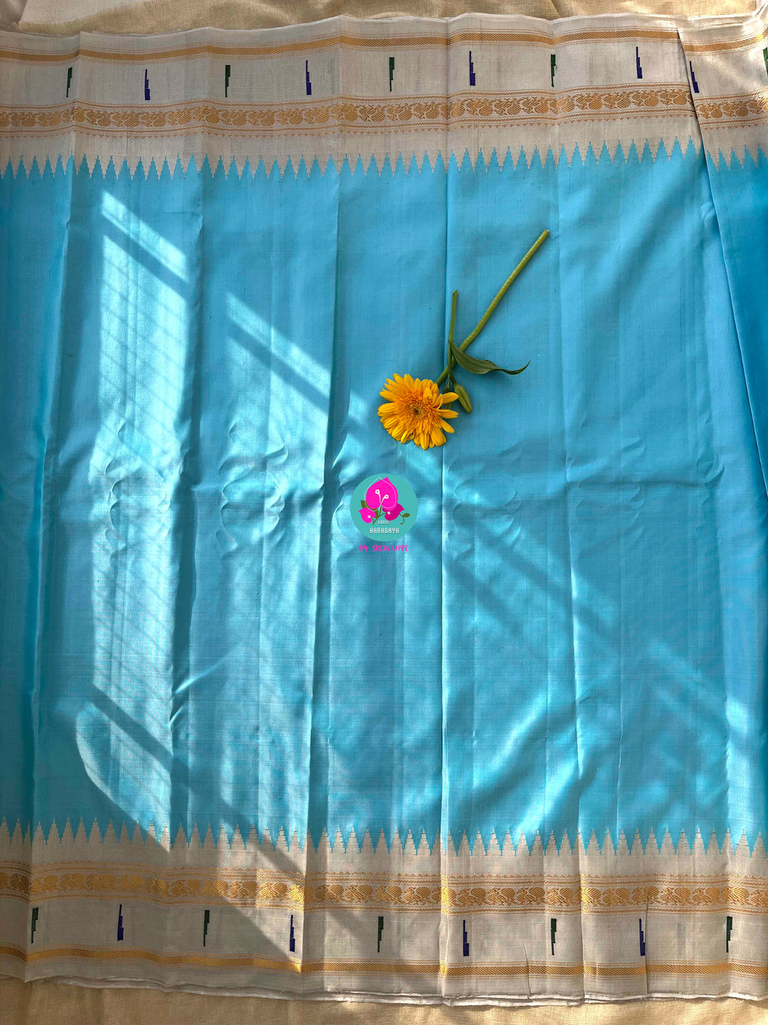 Light Blue Tissue Gadwal muniya border saree with Hand-Embellished Party Wear Detail