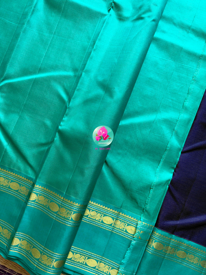 Midnight Currents: Dark Blue Vaira Oosi Kanchipattu Saree with Sea Green Border