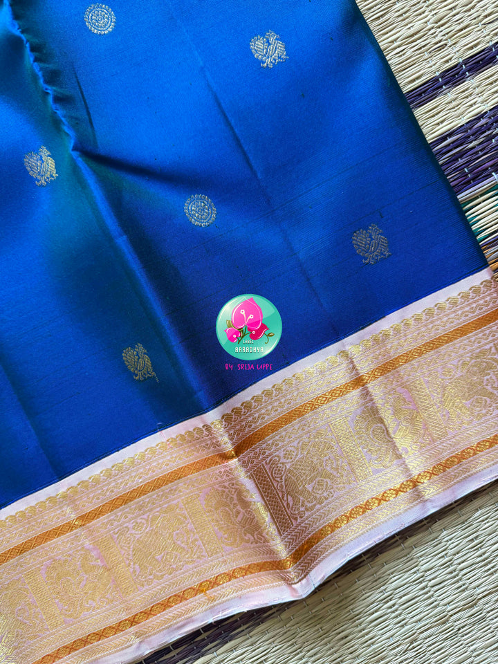 The Midnight Bloom: Dark Royal Blue Kanchipattu Saree with Petal Pink Border
