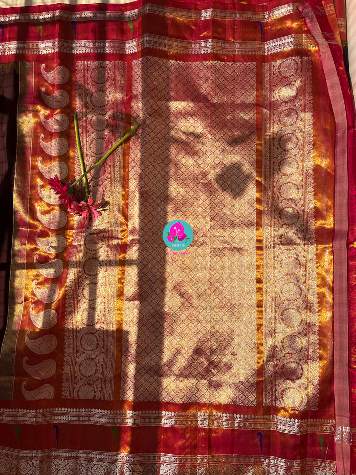 Cocoa Elegance: Deep Brown Tissue Gadwal Saree with Shimmering Orange Muniya Border