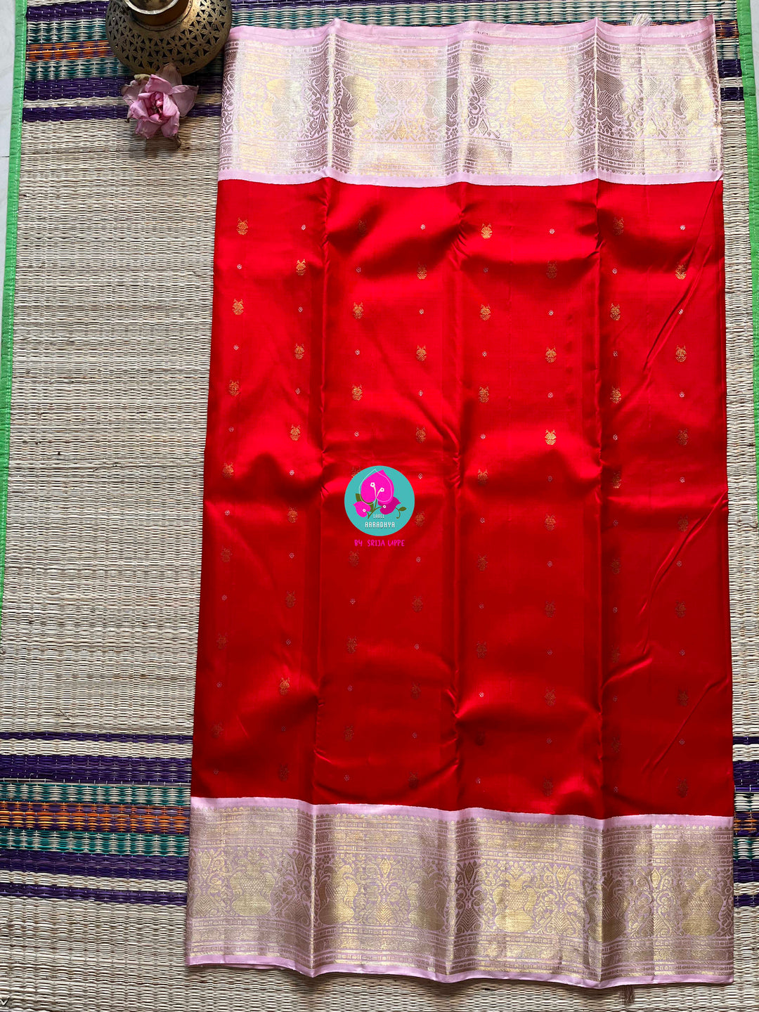 Red and baby pink saree with traditional motif from Kanchipuram