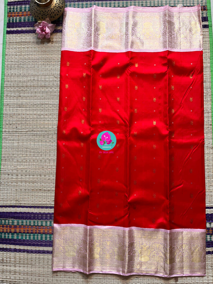 Red and baby pink saree with traditional motif from Kanchipuram