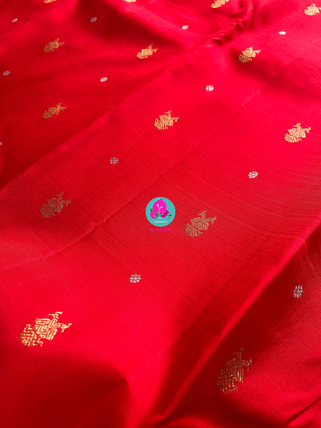 Red and baby pink saree with traditional motif from Kanchipuram