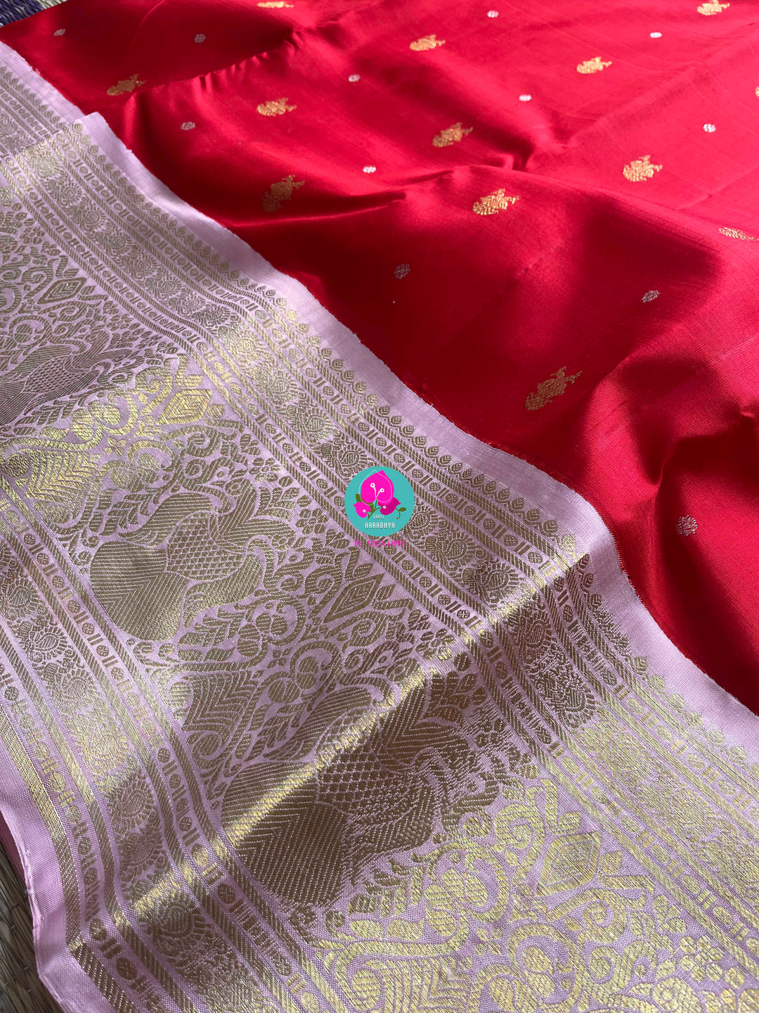 Red and baby pink saree with traditional motif from Kanchipuram