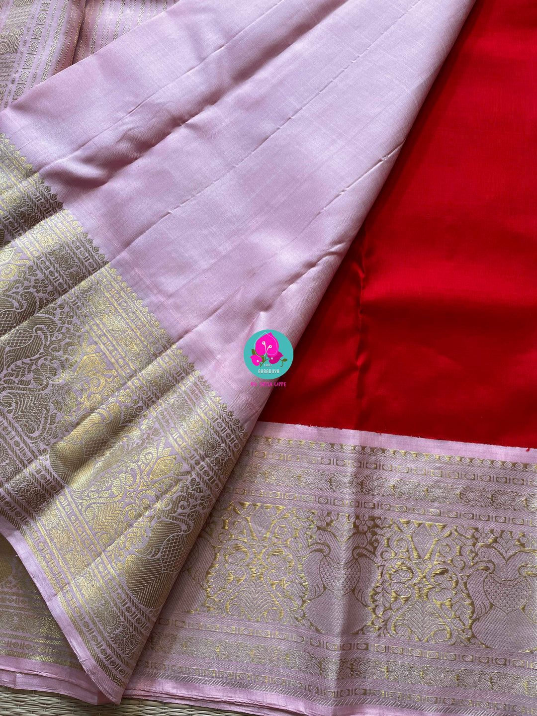 Red and baby pink saree with traditional motif from Kanchipuram