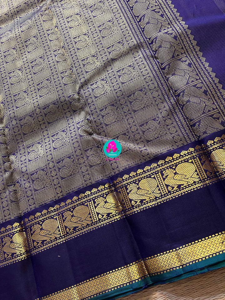 2g zari Vaira Oosi check butta in beautiful shade of blue with gap border