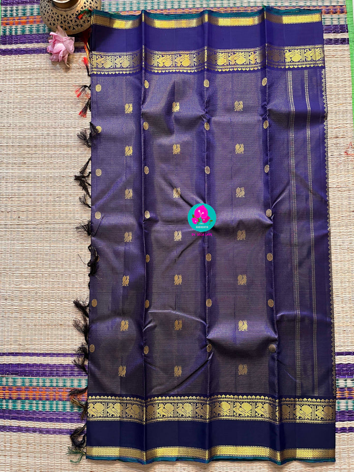 2g zari Vaira Oosi check butta in beautiful shade of blue with gap border