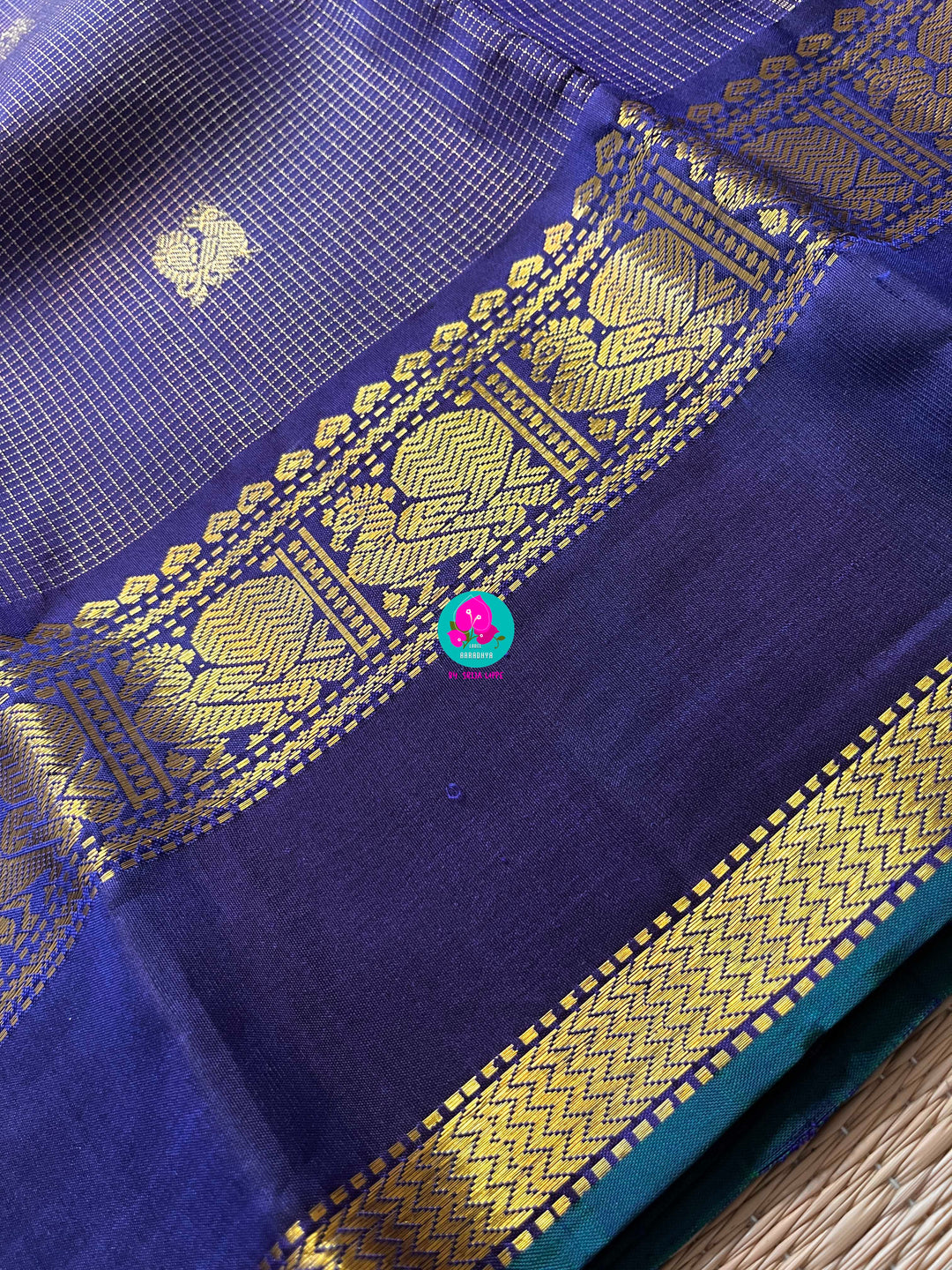 2g zari Vaira Oosi check butta in beautiful shade of blue with gap border