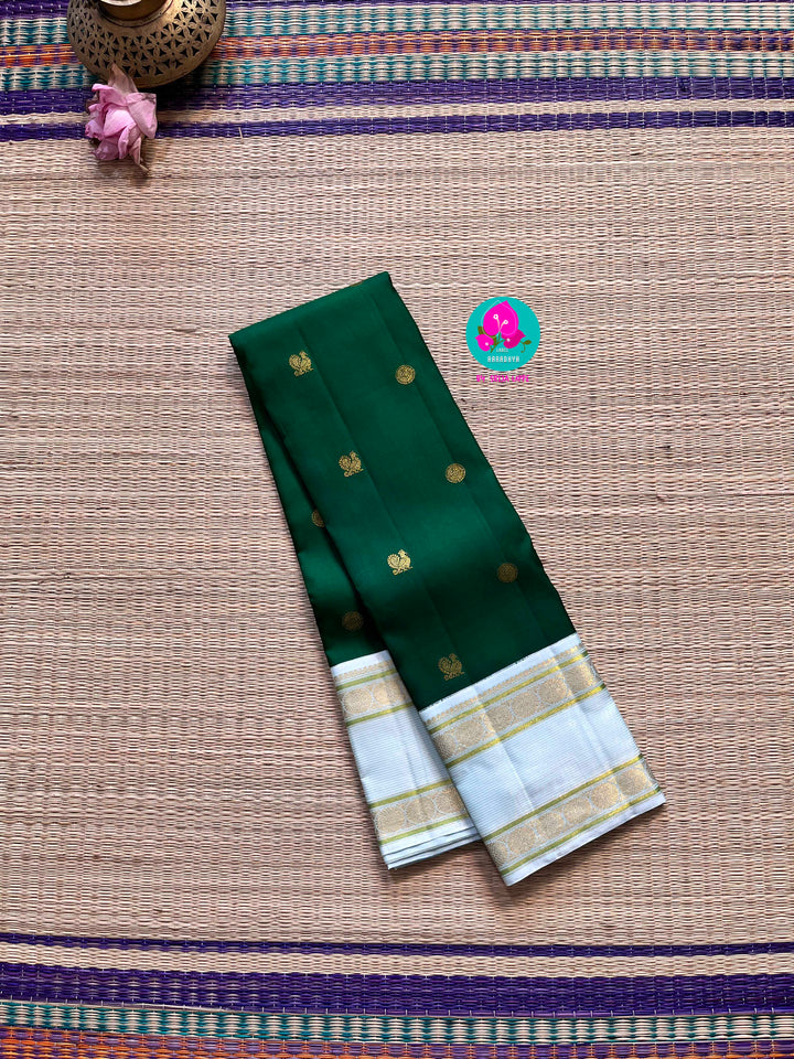 Bottle green vintage saree with ice blue border is one of a kind