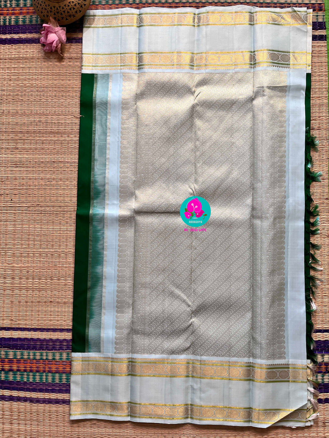 Bottle green vintage saree with ice blue border is one of a kind