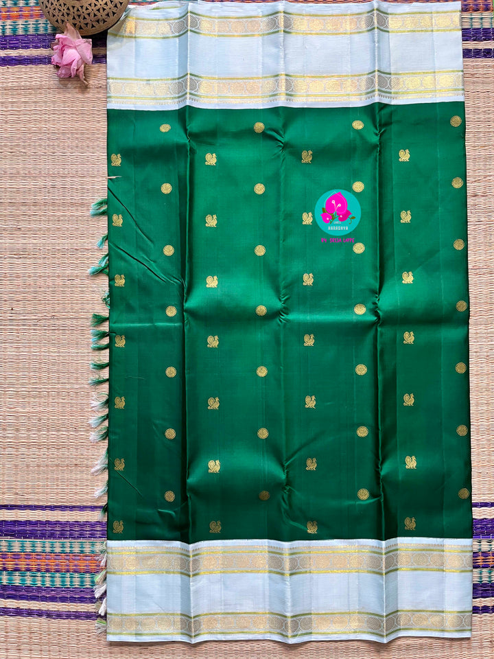 Bottle green vintage saree with ice blue border is one of a kind