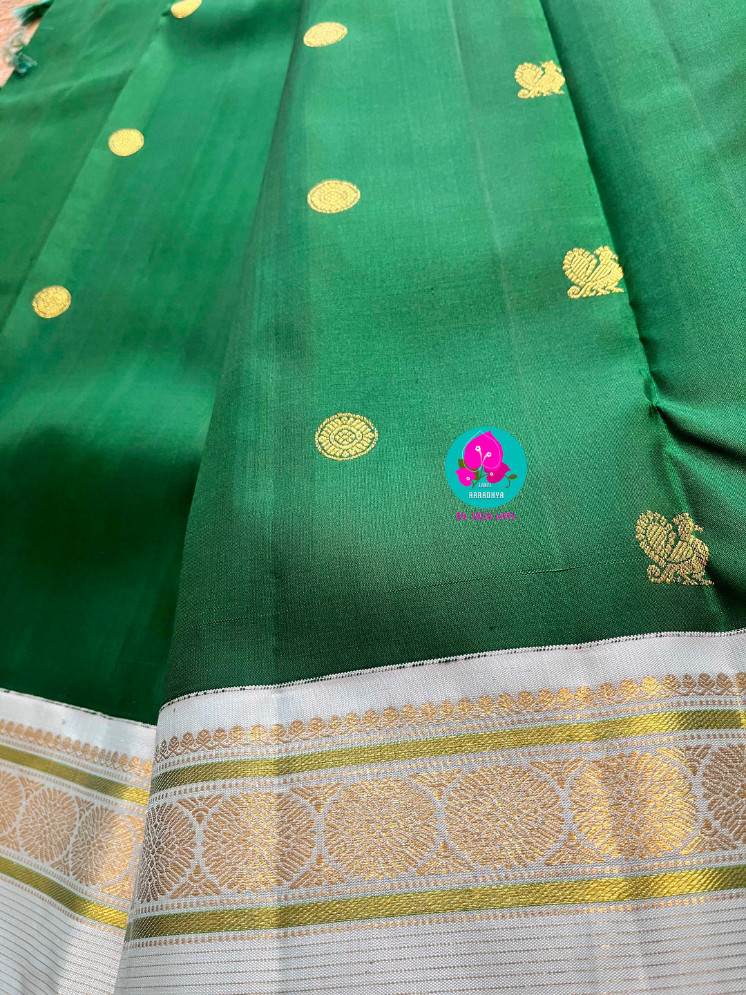 Bottle green vintage saree with ice blue border is one of a kind