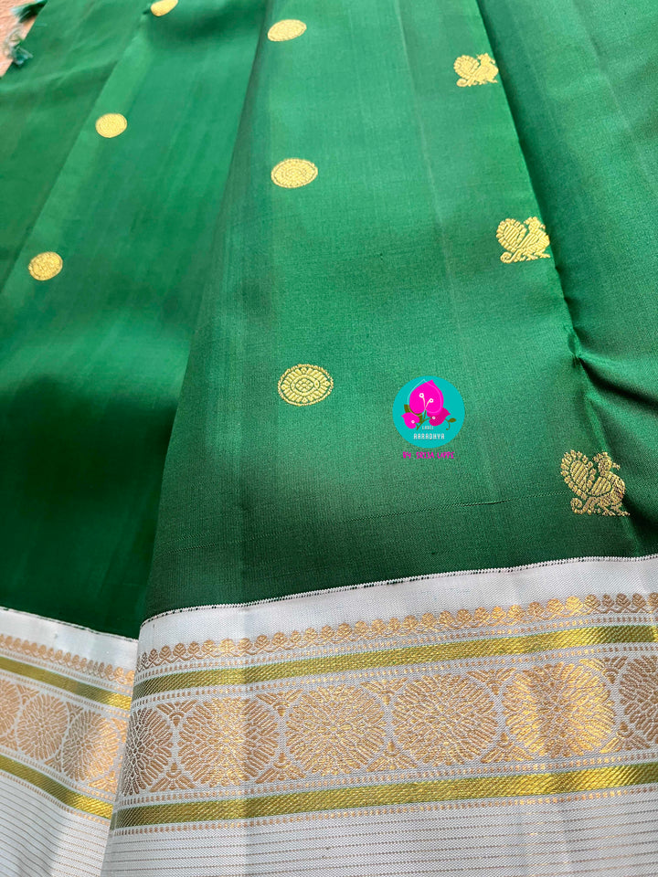 Bottle green vintage saree with ice blue border is one of a kind