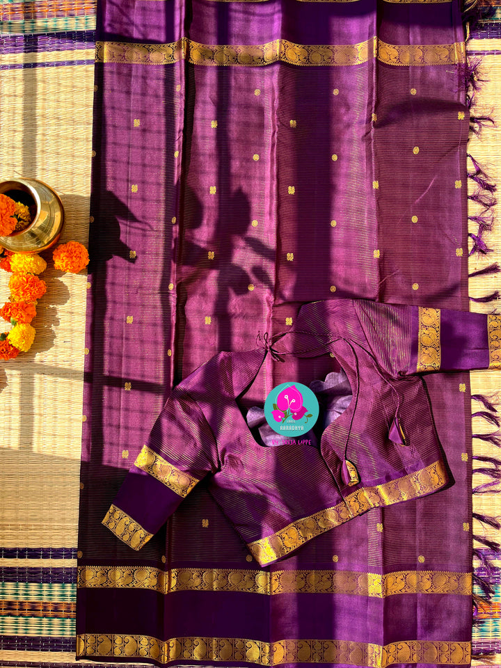 Vaira oosi pure Kanchipattu gap border with peacock motifs in purple paired with blouse