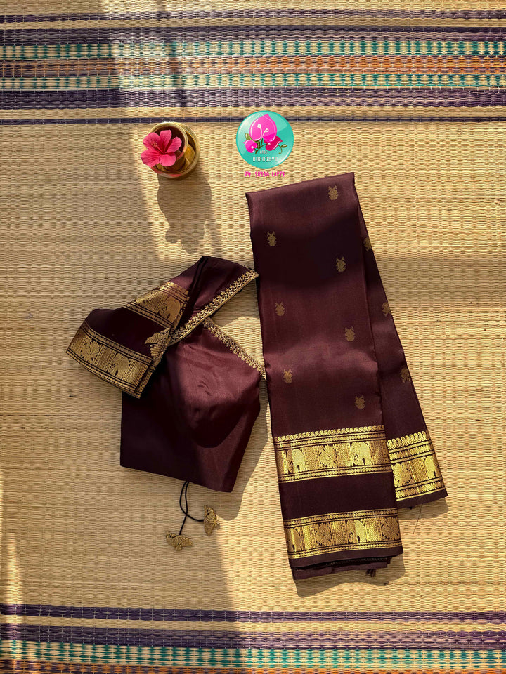 Trendy Brown Kanchipattu silk Saree with Commanding Gandaberunda Motifs