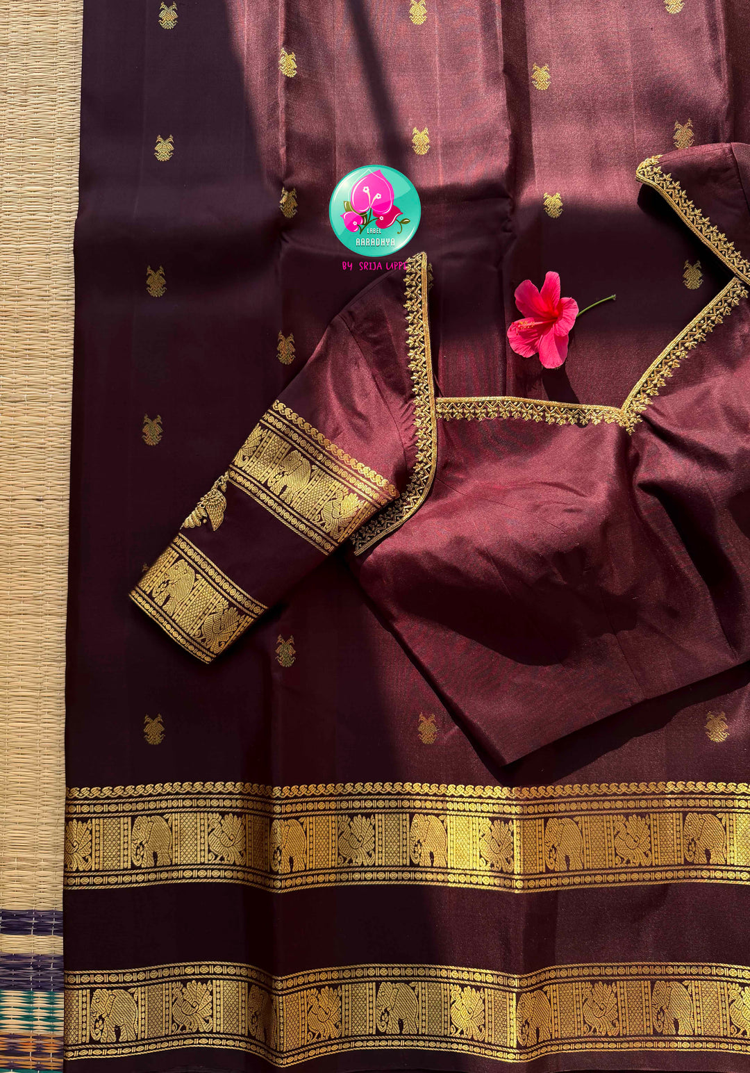 Trendy Brown Kanchipattu silk Saree with Commanding Gandaberunda Motifs