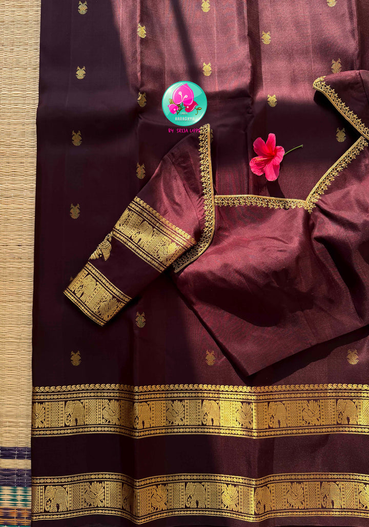 Trendy Brown Kanchipattu silk Saree with Commanding Gandaberunda Motifs