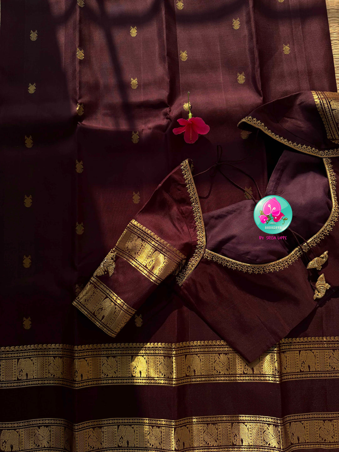 Trendy Brown Kanchipattu silk Saree with Commanding Gandaberunda Motifs