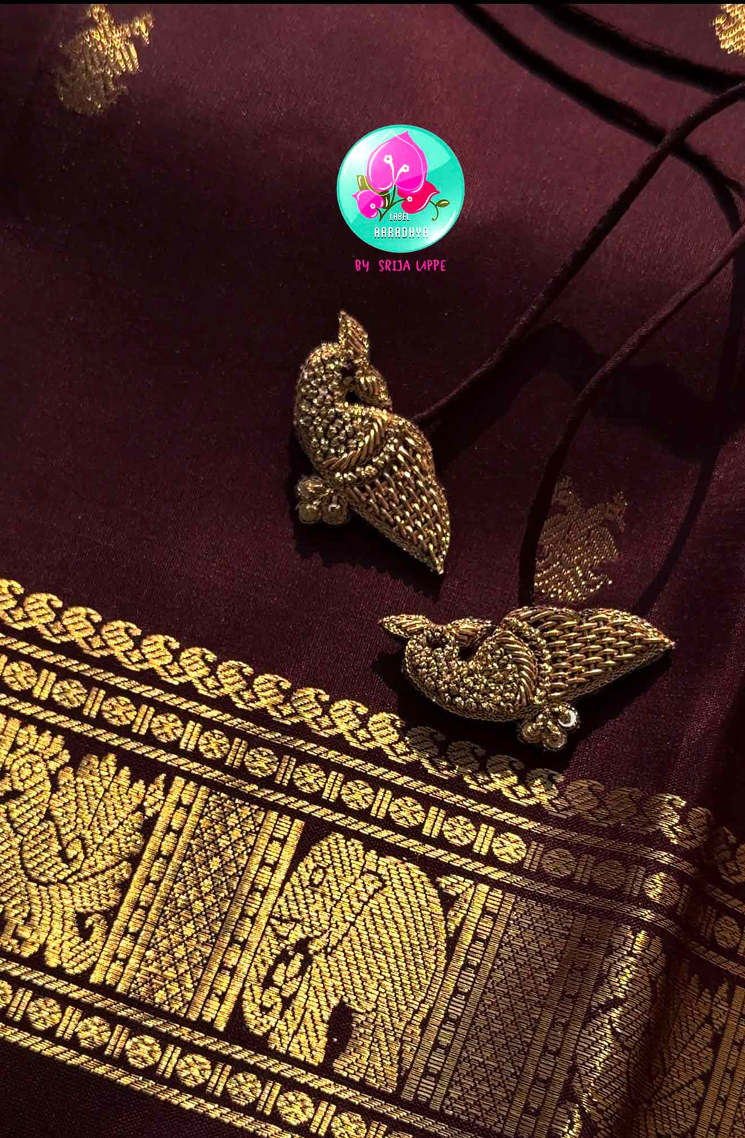 Trendy Brown Kanchipattu silk Saree with Commanding Gandaberunda Motifs