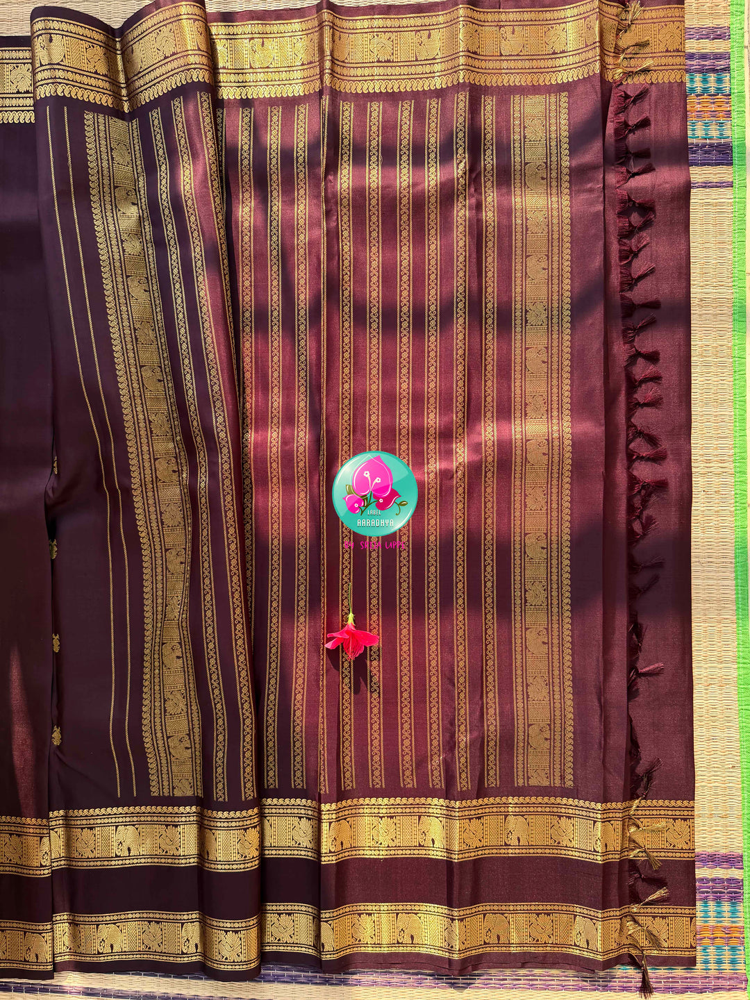 Trendy Brown Kanchipattu silk Saree with Commanding Gandaberunda Motifs