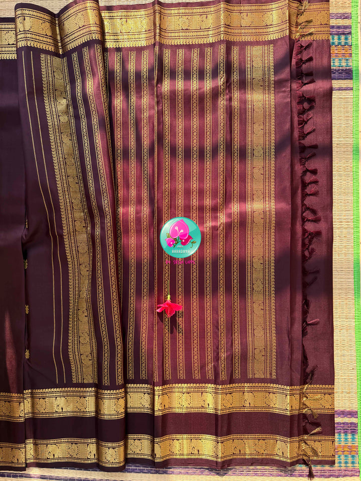 Trendy Brown Kanchipattu silk Saree with Commanding Gandaberunda Motifs