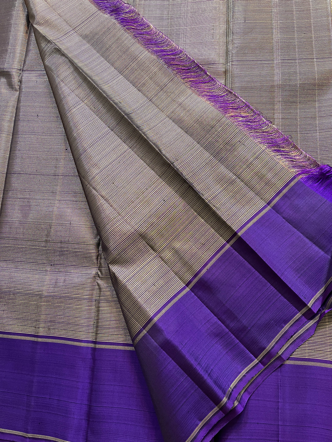 Purple blue with vintage Zari lines all over is one of a kind
