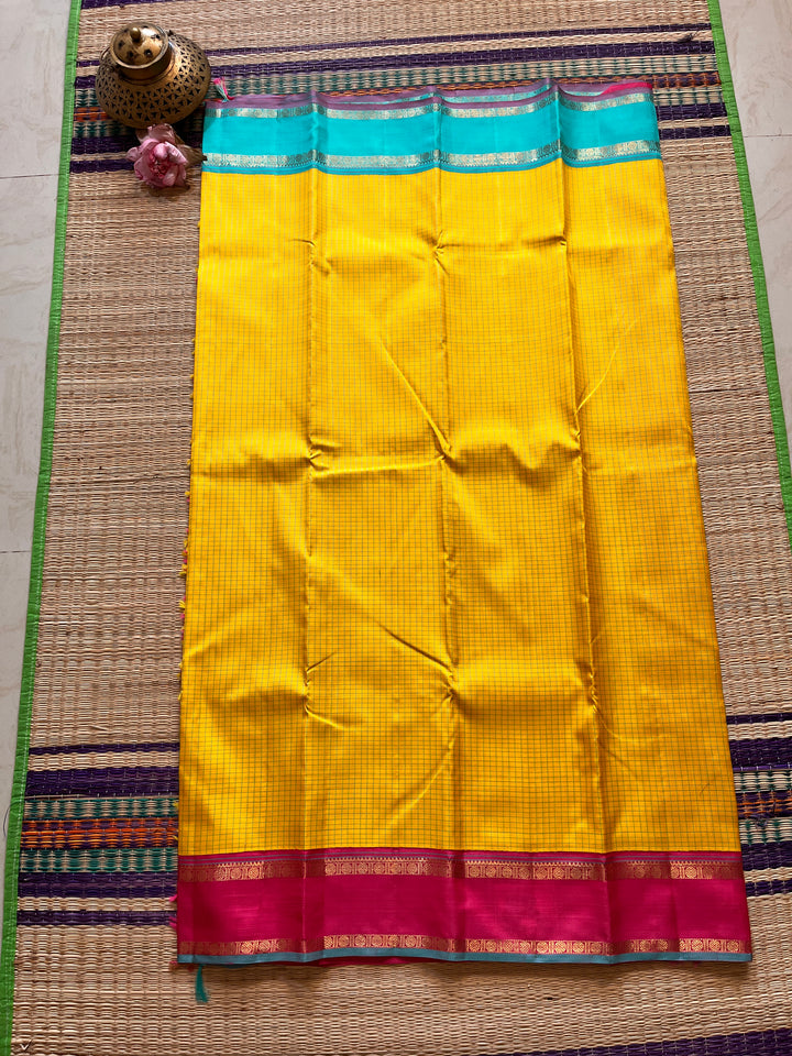 Pure zari Kanchipattu saree with madras checks and Ganga Jamuna border