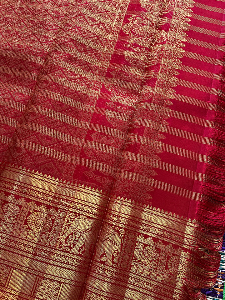 Red Kanchipattu saree in traditional motifs with borders