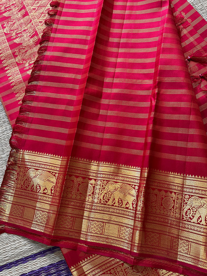 Red Kanchipattu saree in traditional motifs with borders