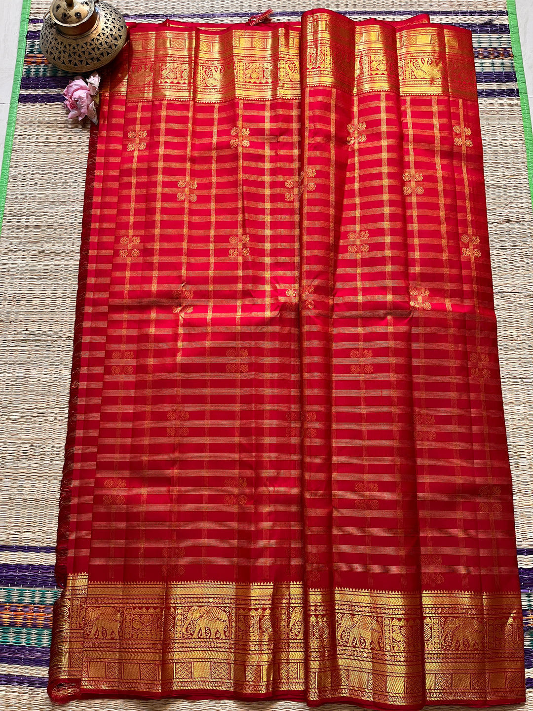 Red Kanchipattu saree in traditional motifs with borders