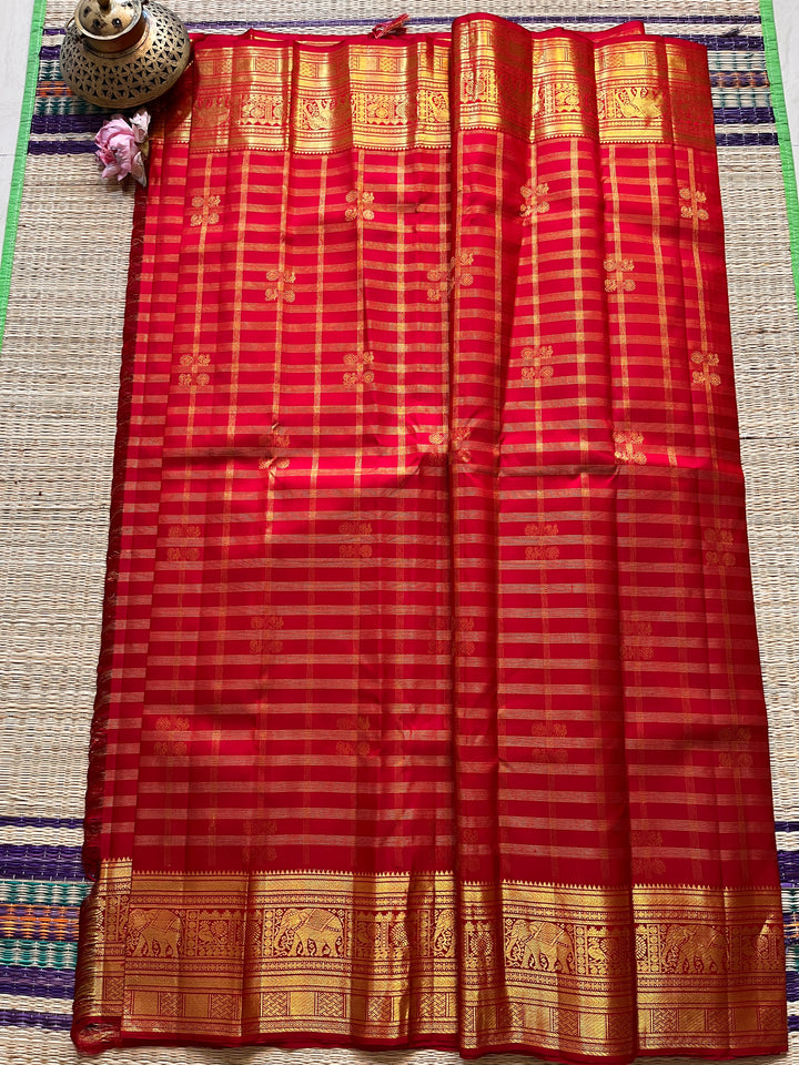 Red Kanchipattu saree in traditional motifs with borders