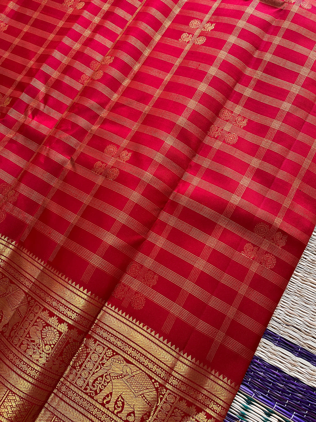 Red Kanchipattu saree in traditional motifs with borders
