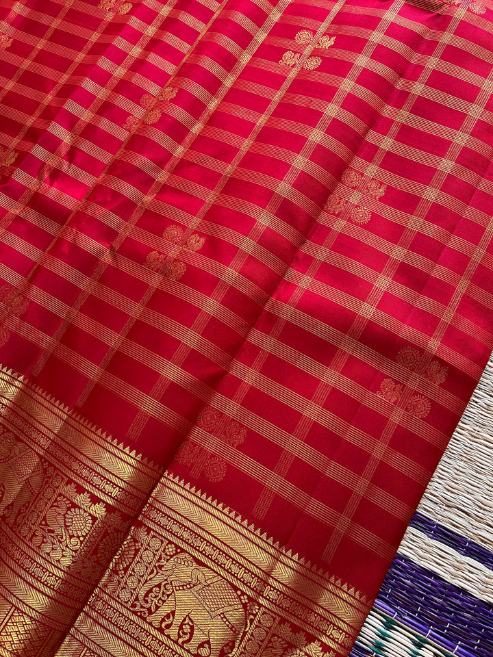 Red Kanchipattu saree in traditional motifs with borders