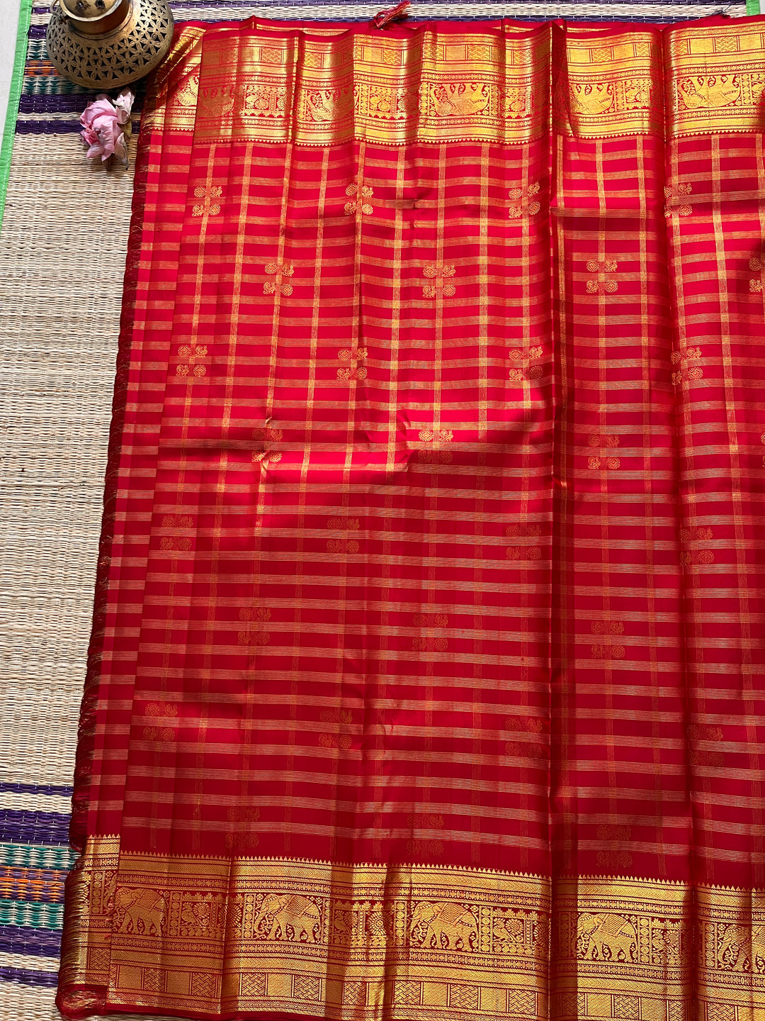 Red Kanchipattu saree in traditional motifs with borders