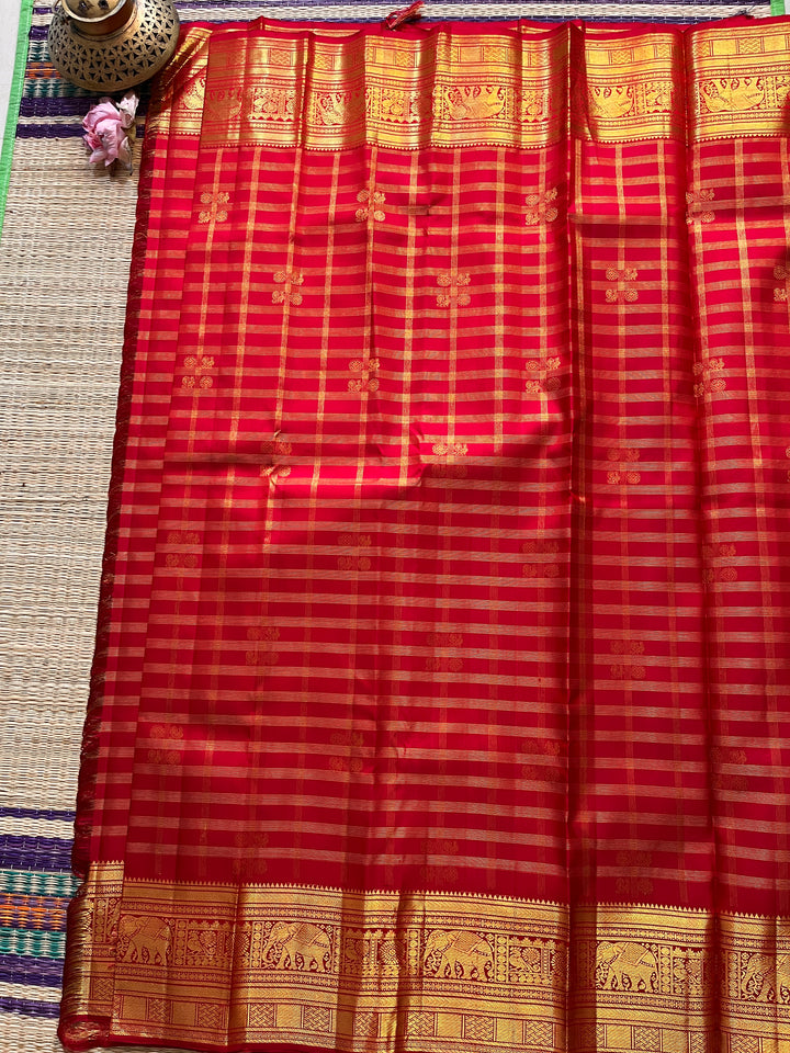 Red Kanchipattu saree in traditional motifs with borders