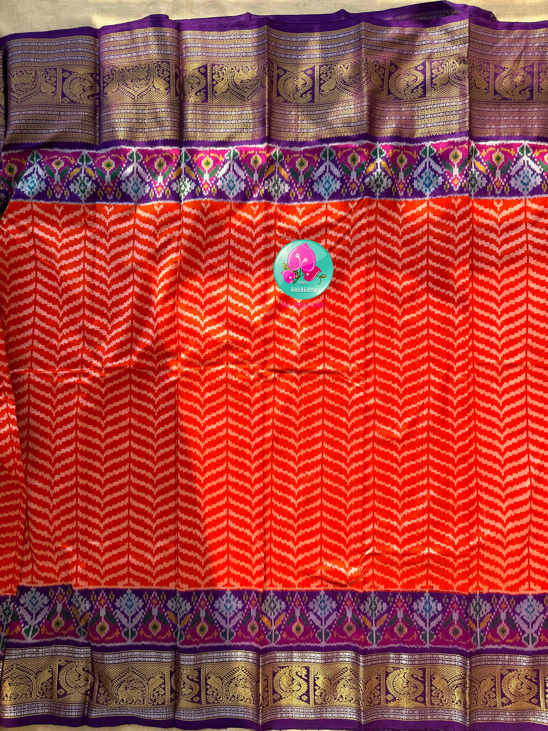 Sunset Waves: Leheriya Orange Ikkat Silk Saree with Kanchi Heritage Border