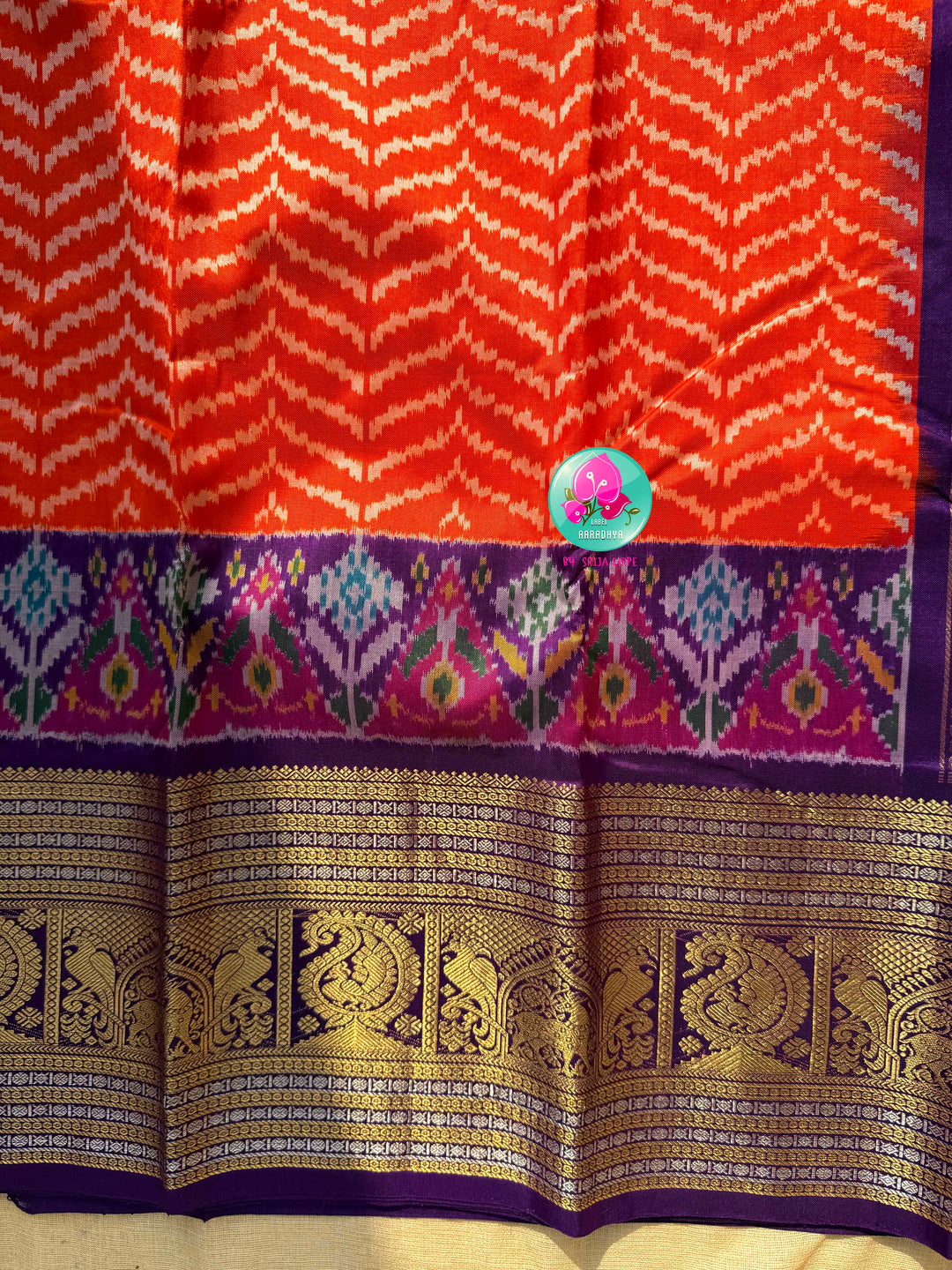 Sunset Waves: Leheriya Orange Ikkat Silk Saree with Kanchi Heritage Border