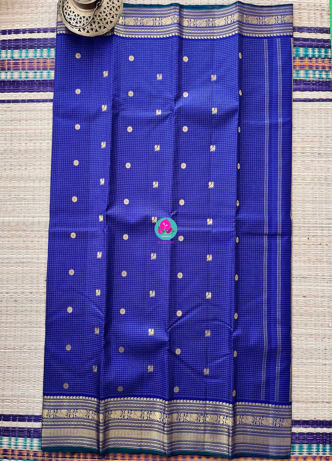 2g zari Vaira Oosi check butta saree in beautiful shade of blue with Hand Embroidered Peacock color fusion Blouse
