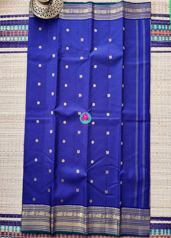 2g zari Vaira Oosi check butta saree in beautiful shade of blue with Hand Embroidered Peacock color fusion Blouse