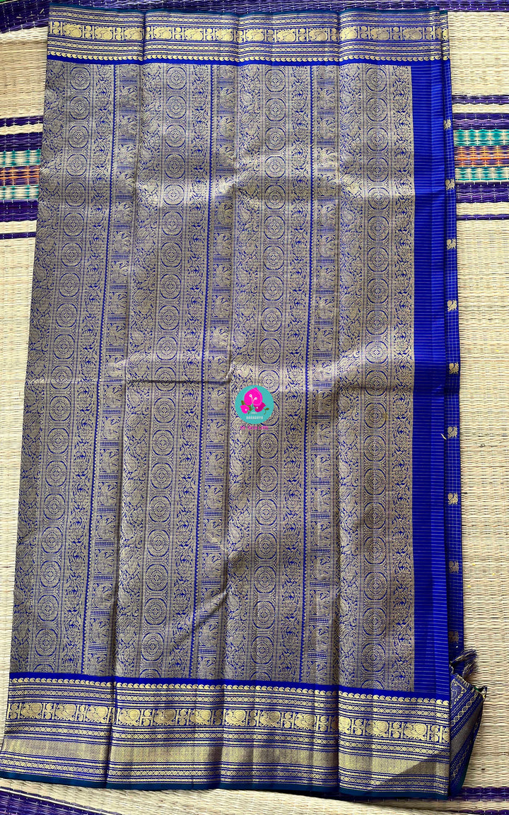 2g zari Vaira Oosi check butta saree in beautiful shade of blue with Hand Embroidered Peacock color fusion Blouse
