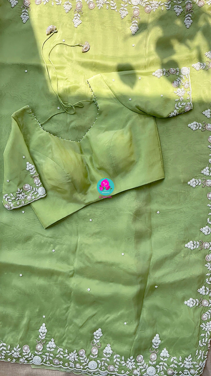 Satin crape saree with hand embroidered pearl work paired with Hand Embroidered Blouse