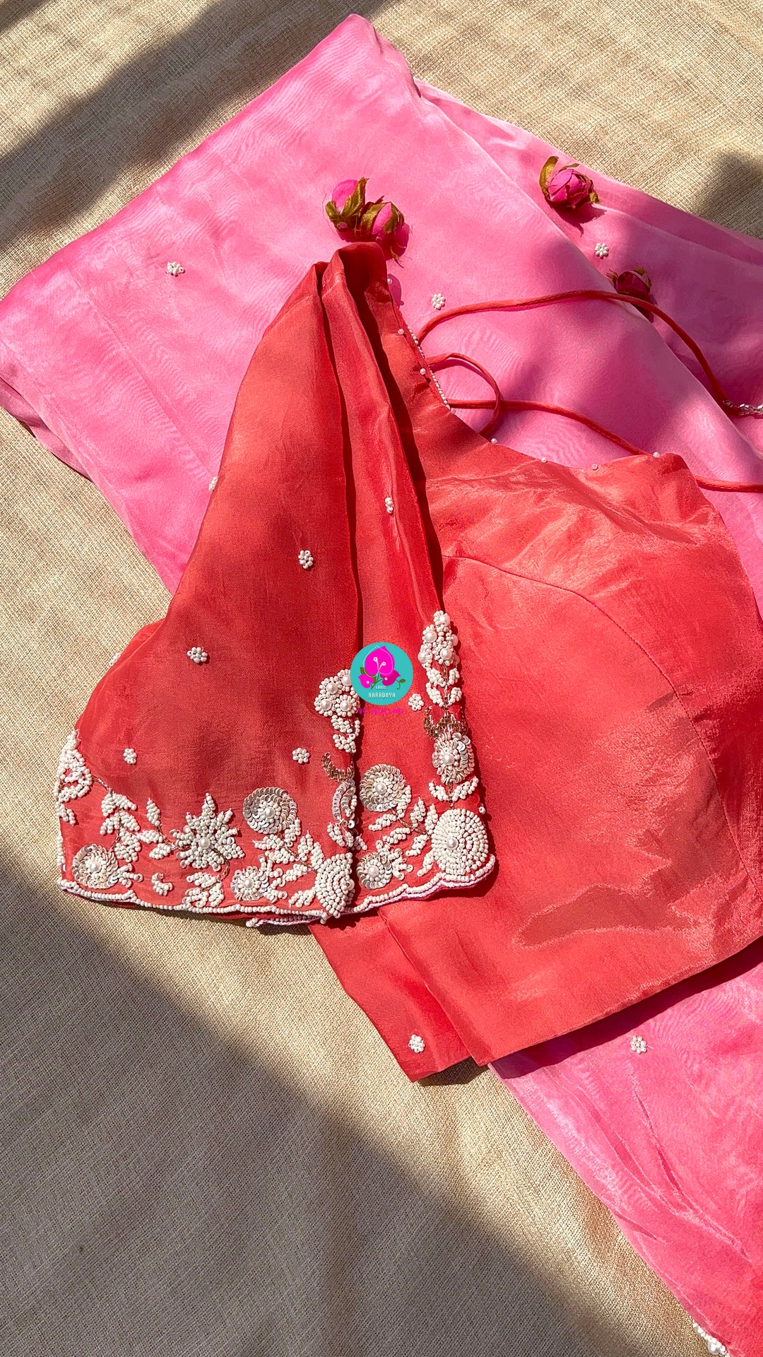 Dual shaded pink and peach saree in satin crape with hand embroidered pearl work paired with Hand Embroidered Blouse