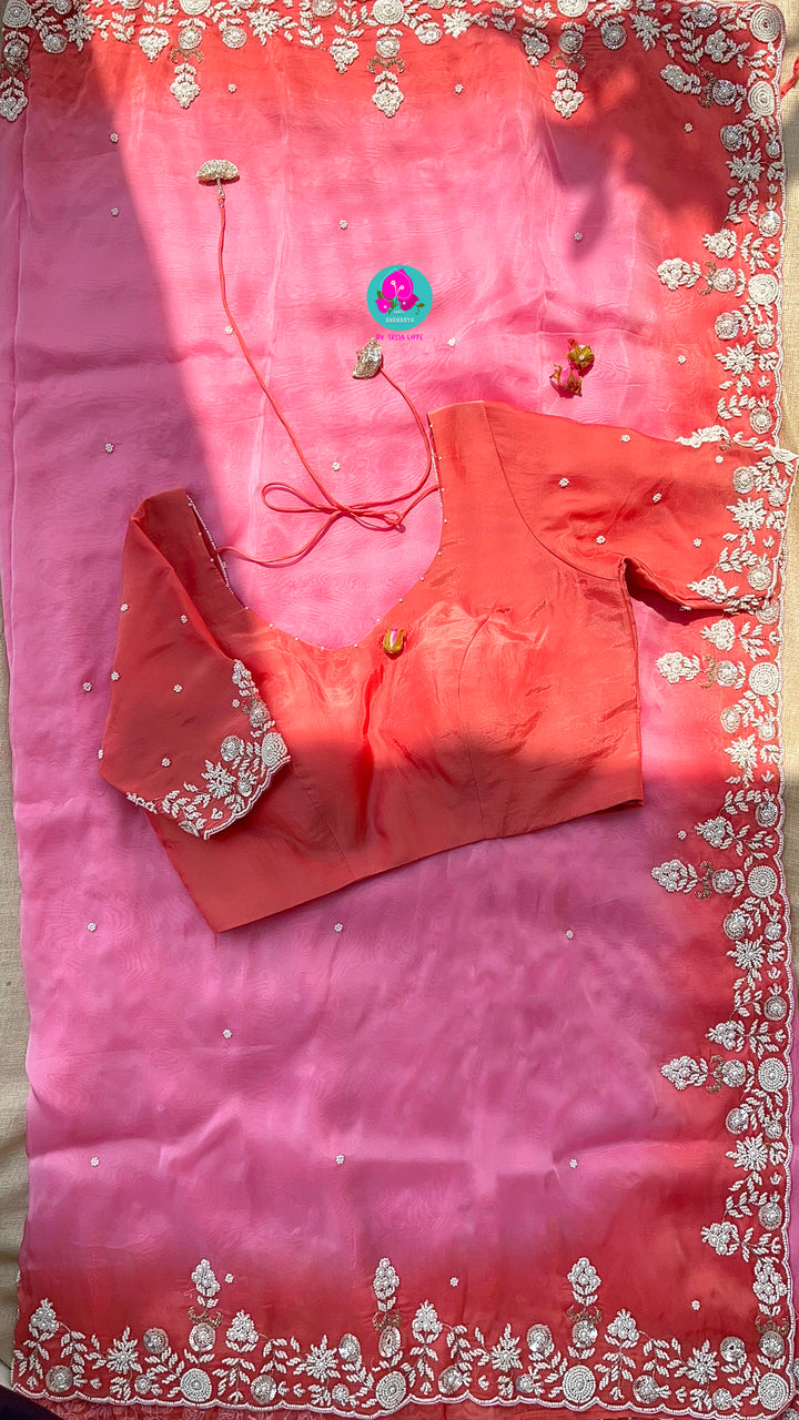 Dual shaded pink and peach saree in satin crape with hand embroidered pearl work paired with Hand Embroidered Blouse
